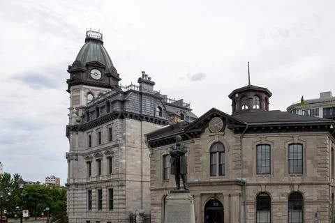 John Young Monument in front of Old Port of Montreal Corporation building in Stock Photos