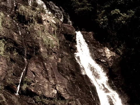 John's Mountain Overlook, Lafayette, GA; Cascading water falling down rock cliff Stock Footage 86750795