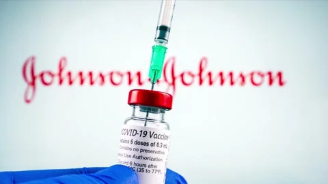 Johnson and johnson logo and covid-19 coronavaccine injection vial, sterile g Stock Footage 170629899