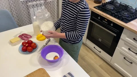 Join a boy as he creates the perfect pizza, shaping the dough Stock Footage 302917160