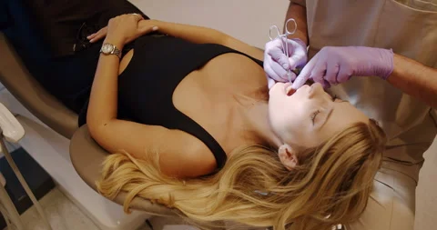Join a Dental Treatment Session focused on Professional Care and patient comfort Stock Footage 318279474
