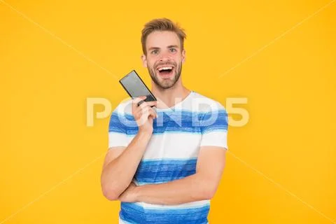 Join digital world. Download application. Guy hold smartphone. Guy happy smiling Stock Photos