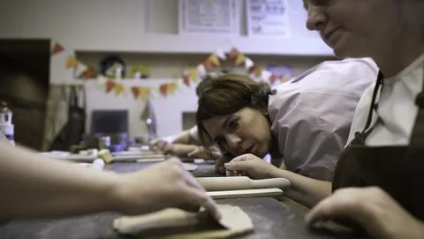 Join a fun Hands On Baking Class with eager participants ready to learn and Stock Photos