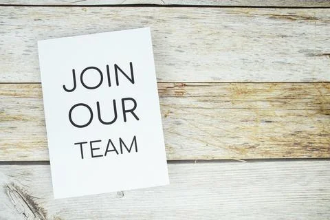 Join Our team text on paper card top view on wooden background Stock Photos