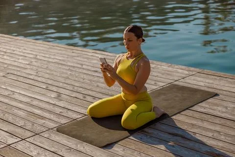 Join a refreshing Yoga session at Lakeside to enhance mindfulness and inner Stock Photos