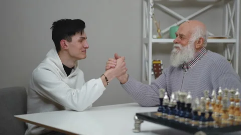 Join us for an engaging intergenerational chess match that fosters connections Stock Footage 285980469