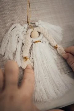 Join us as we work on a handmade macrame angel ornament craft project, focu.. Stock Photos