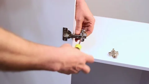 Joiner assembly furniture using hand tools screwdriver. Furniture assembly Stock Footage 167322089