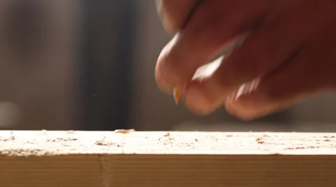 Joiner drive a nail into a board Stock Footage 58936562