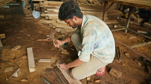 Joiner hammers the chisel to cut wood Stock Footage 301438344