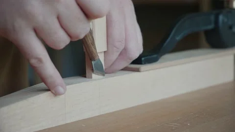 Joiner makes a mark with a knife Making handmade furniture 動画素材 156499680