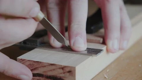 Joiner makes a mark with a knife Making handmade furniture Stock Footage 156500288