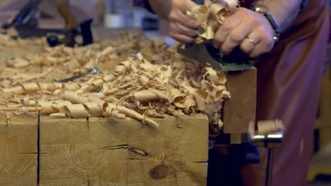 Joiner Planes Solid Wood in his Workshop Stock Footage 84909472