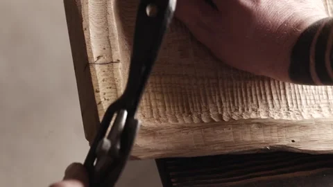 Joiner processes the edges of an oak wood board with spokeshave. Craftsmanship. Stock Footage 166082298