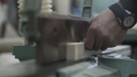 Joiner sanding board surface on white belt sander machine in factory, close up. Stock Footage 88160127
