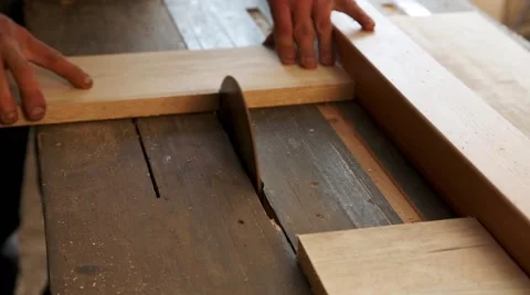 Joiner sawing plank on a saw circulation in workshop 스톡 동영상 58936635