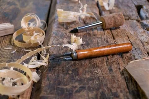 Joiner tools on an old workbench. Traces of wood processing. Stock Photos