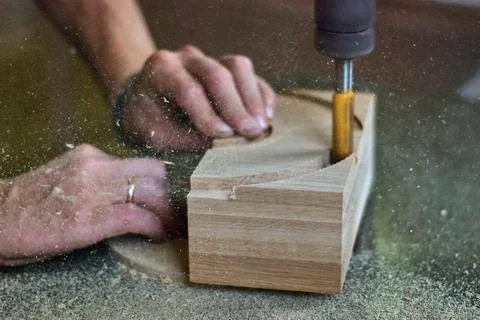 Joiner working with vertical milling machine . Processing of wooden products Stock Photos