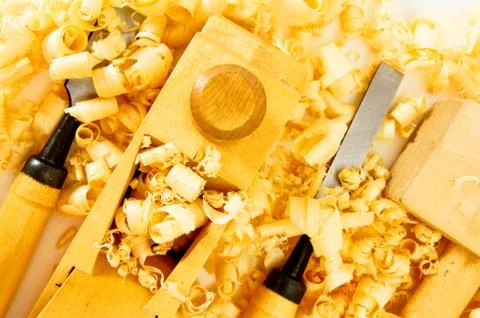 Joiner's tools ( plane, chisel, hammer) and shaving. Stock Photos