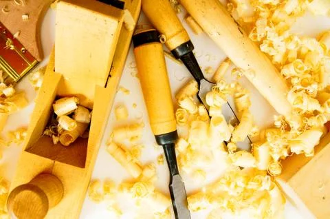 Joiner's tools ( plane, chisel, hammer) and shaving. Stock Photos