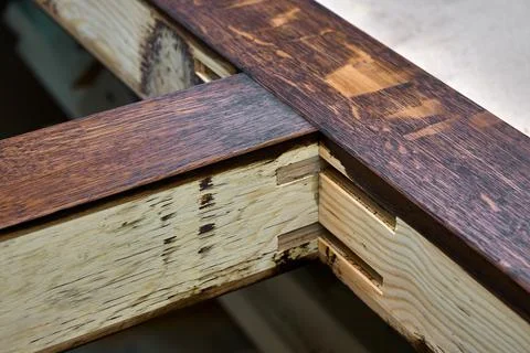 Joinery. Door frame, painted in dark color. Wood door manufacturing process Stock Photos