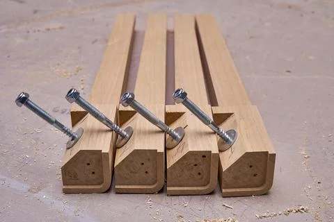 Joinery. Solid wood table legs building process. Wooden furniture manufacturing Fotos de archivo