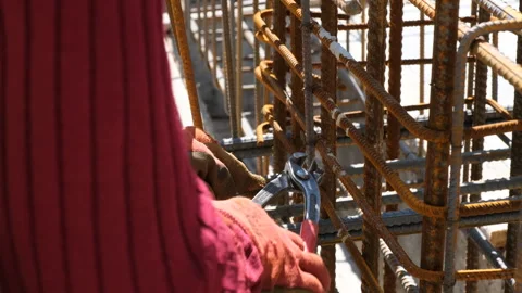 Joining iron bars to reinforce concrete pillars, construction, fa01 Stock Footage 277895673