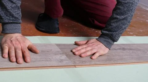 Joining laminate sheets on the floor in a room Stock Photos