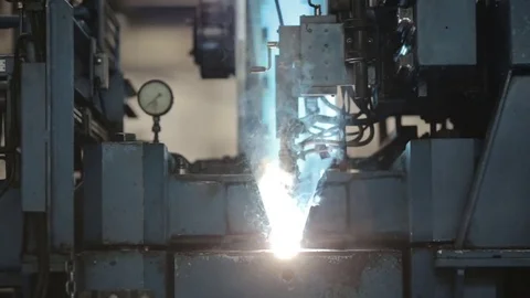 The joining of two sheets of metal for the manufacture of pipes. Stock Footage 76935085