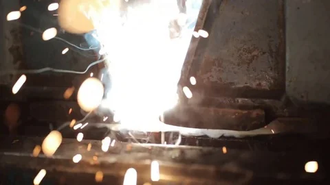 The joining of two sheets of metal for the manufacture of pipes. Stock Footage 76938055