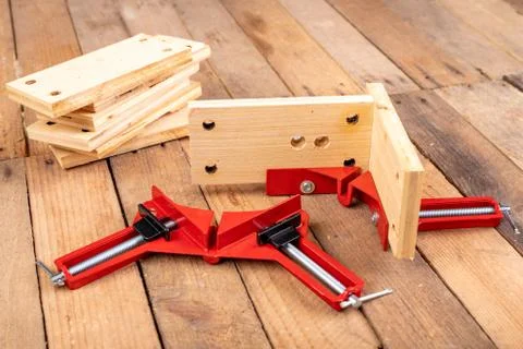 Joining wood using a carpentry clamp. Small carpentry work. Stock Photos