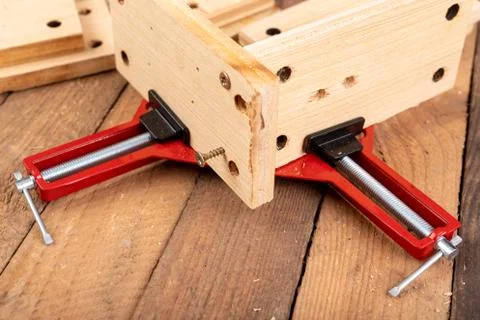 Joining wood using a carpentry clamp. Small carpentry work. Stock Photos