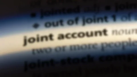 Joint account word in a dictionary. Stock Footage 99561783