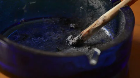 Joint in ashtray close up tracking Stock Footage 37798796