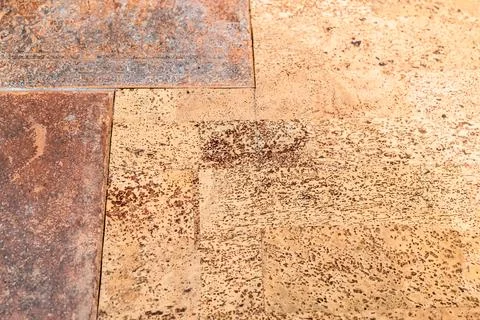 Joint between ceramic tiles and cork flooring Stock Photos