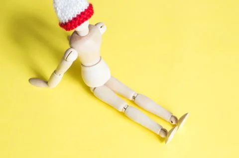 Joint doll on yellow background Stock Photos