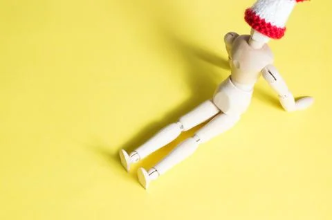 Joint doll on yellow background Stock Photos
