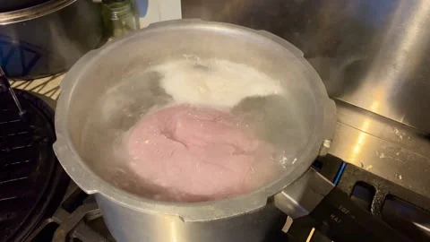 Joint of gammon boiling in a pan Stock Footage 259555948