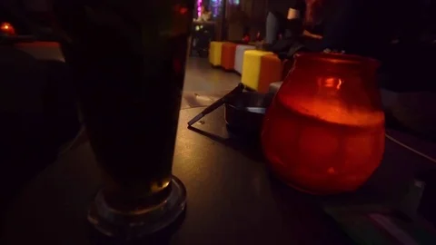 Joint with marijuana. Cigarette on a table in a coffee shop in Amsterdam Stock Footage 81371144