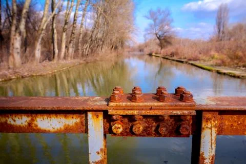 Joint of steel construction on the bridge, rusty screws Stock Photos