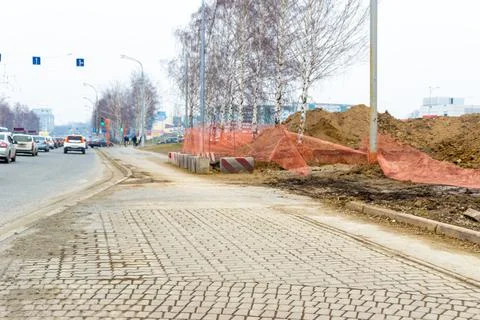 Joint of two types of paving slabs, in the distance, in blur, repair of Stock Photos