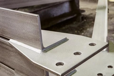 Jointing shaped element of galvanized metal construction close-up Stock Photos