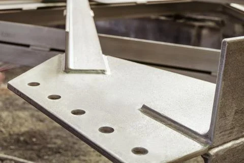 Jointing shaped element of galvanized metal construction close-up Stock Photos