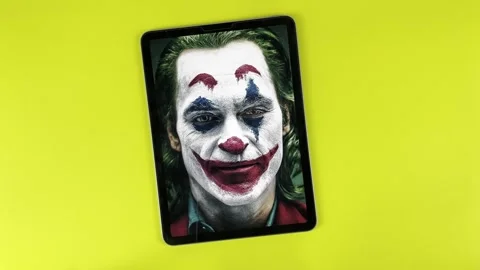 A Joker face in an Ipad Stock Footage 322518083