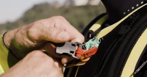 Jokke Sommer getting breathing techniques advice while tightening life jacket Stock Footage 163076166