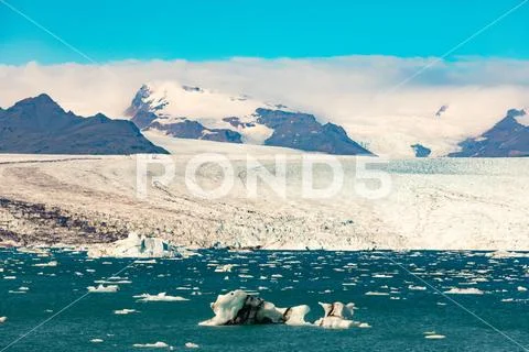 Jokulsarlon glacial lagoon and ice of Vatnajokull Stock Photos