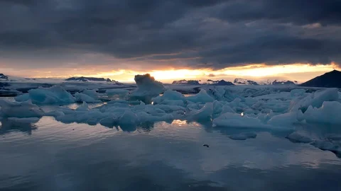 Jokulsarlon Glacier Lagoon under dramatic fire and ice sunset Stock Footage 120304765