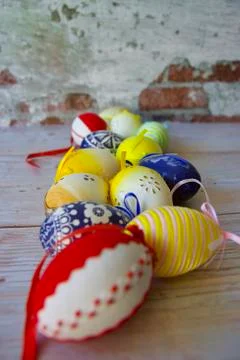 Jolly colourful Easter eggs on a table Stock Photos
