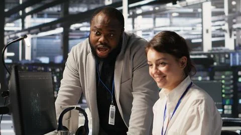Jolly data center engineering team pleased after finishing system maintenance Stock Photos