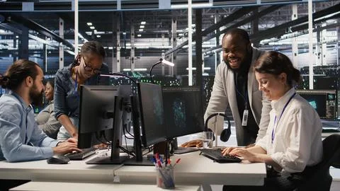 Jolly data center engineering team pleased after finishing system maintenance Stock Photos